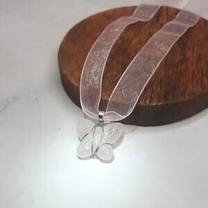 Stone Butterfly Pendant On Shimmery Pink Ribbon